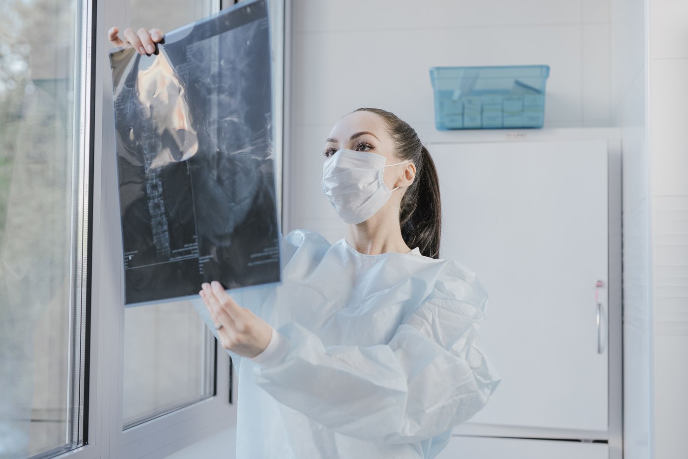A clinician reviewing a cervical spine X-ray